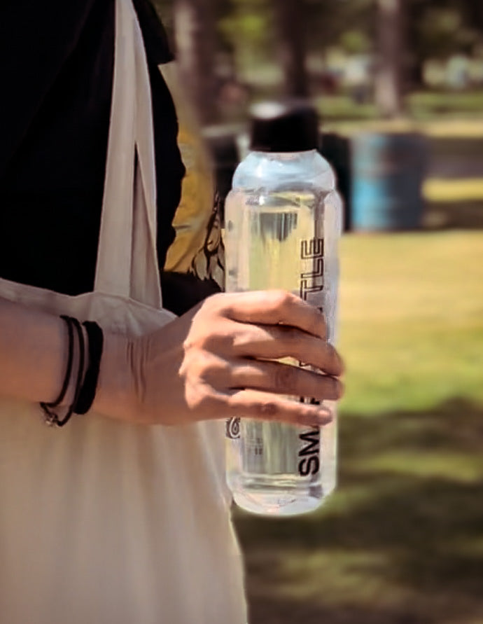 a woman holding her smartbottle